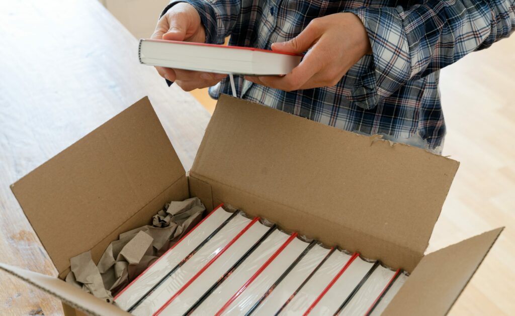 author opens package with samples of her new book and checks the hardcover