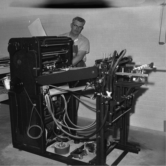 Doc Friesen operating the first Offset press - a Davidson ATF, 1959