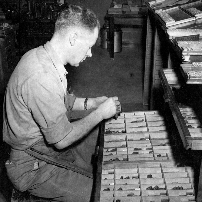 Peter Wolfe, hand setting type from wooden type cases, circa 1938