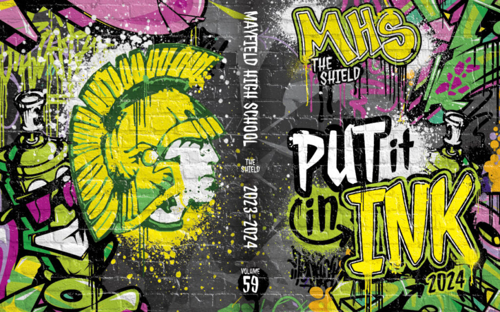 Bold graffiti‑themed yearbook cover with colorful paint splashes, illustrations, and the phrase “Put It in Ink.”