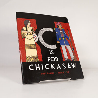 Illustrated book cover of C Is for Chickasaw showing two figures in traditional clothing on a red and black background
