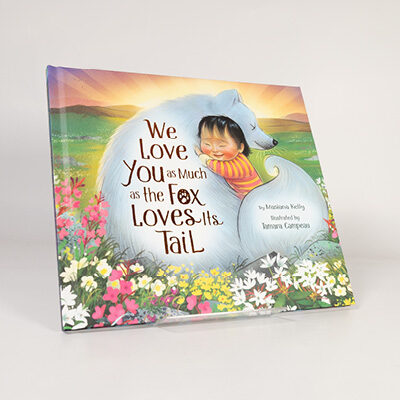 Illustrated book cover featuring a child hugging a white fox surrounded by colorful flowers and a sunset sky