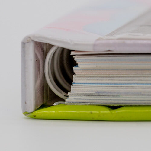 Close-up of a concealed wire-o bound book showing hidden coil inside the hardcover spine