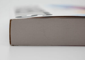 Close‑up of a perfect bound book spine showing the glued edge and stacked pages.