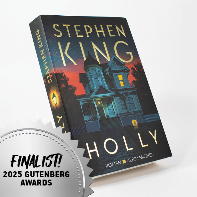 Stephen King’s novel Holly displayed standing, featuring an illustrated house and a 2025 Gutenberg Awards finalist badge