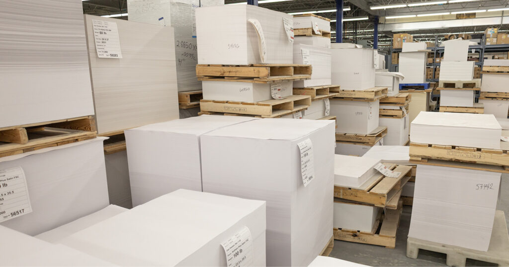 Stacks of paper in varying shades of white, showing how paper whiteness can differ even before printing.