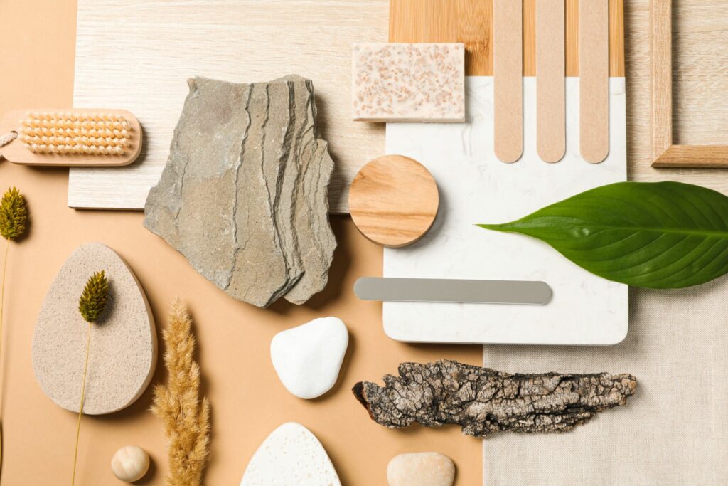 Flat lay of a mood board with various textures and colours.