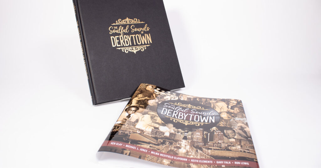 Hardcover book standing beside its illustrated dust jacket, both displayed on a white background.