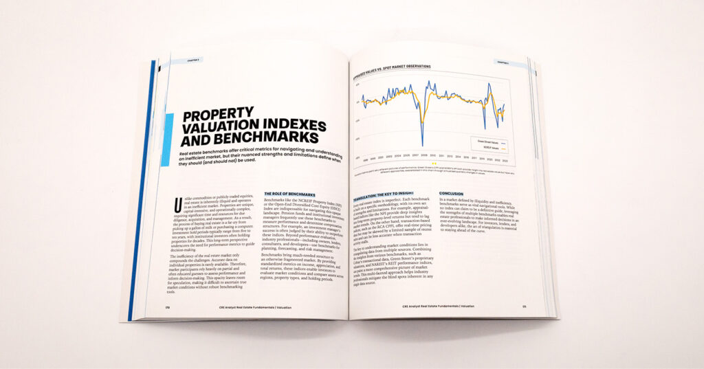 Open book on a white surface showing a spread with charts, headings, and text about property valuation and benchmarks.