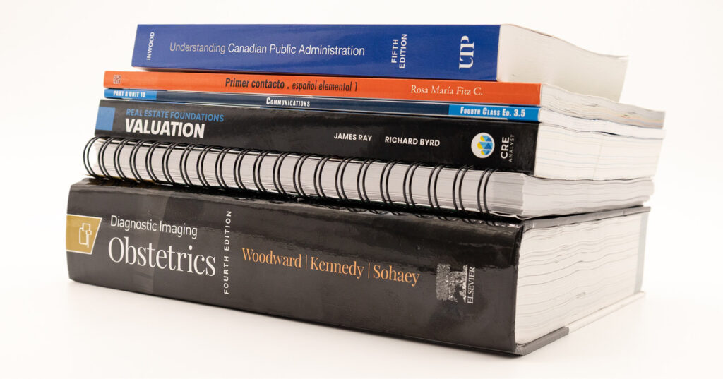 Stack of inkjet-printed educational textbooks showing high-quality colour and binding for modern academic publishing