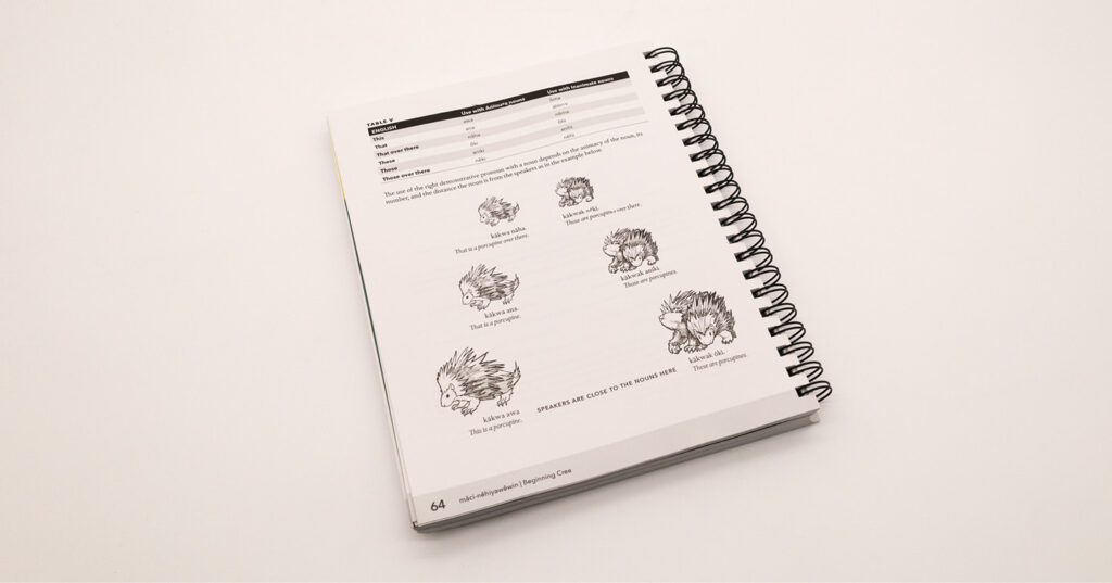 Inkjet-printed spiral-bound educational workbook with clear black-and-white illustrations and crisp text for classroom learning