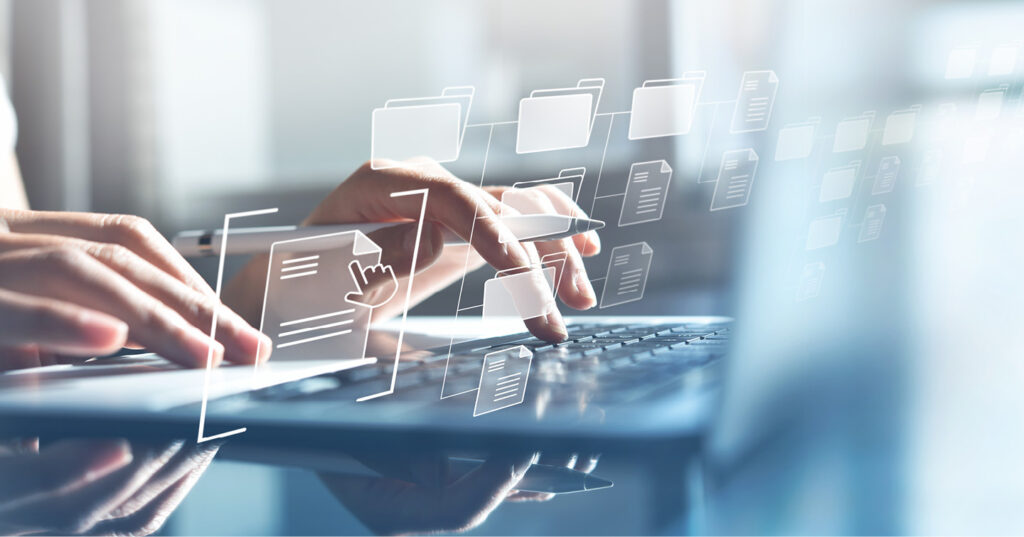 Person using a laptop with digital file and folder icons, representing electronic document management and e-filing.